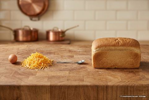 Cheddar cheese, in “What does 200 grams of shredded cheddar cheese look like?”